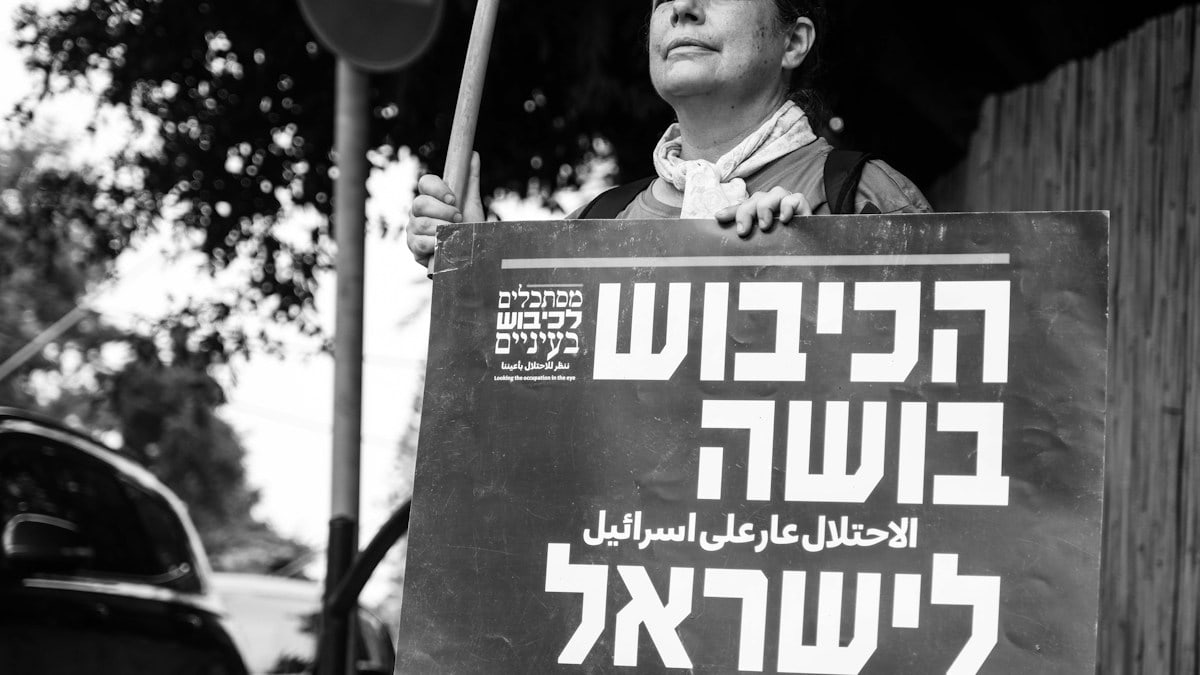 a man holding a sign